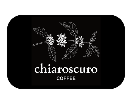 Chiaroscuro coffee bag featuring botanical design on a black background.